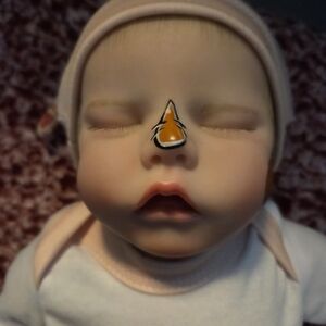 Realistic Baby Doll with Pink Outfit